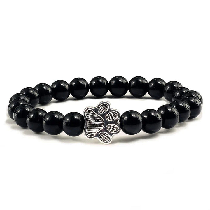 Tassunjäljen armbånd, dekorert med perler og delikat